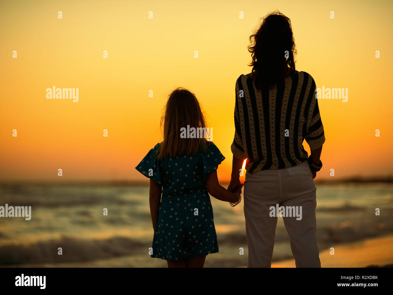 Seen From Behind Mother And Daughter On The Beach In The Evening Looking Into The Distance Mother And Daughter Catch Moments Leisure Sunset Idyllic Stock Photo Alamy