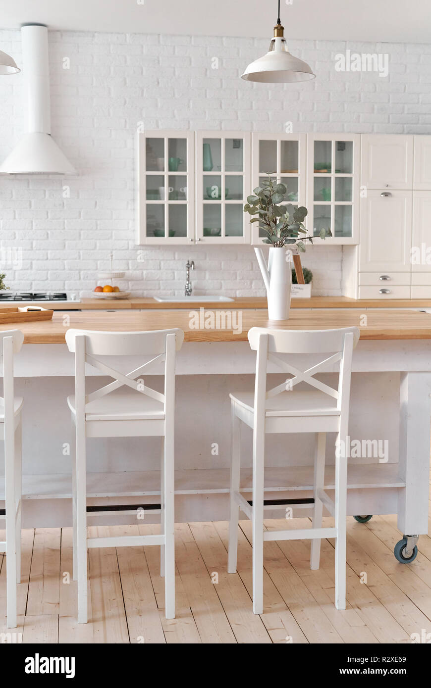 Kitchen table with kitchen chairs. Kitchen background. Stock Photo