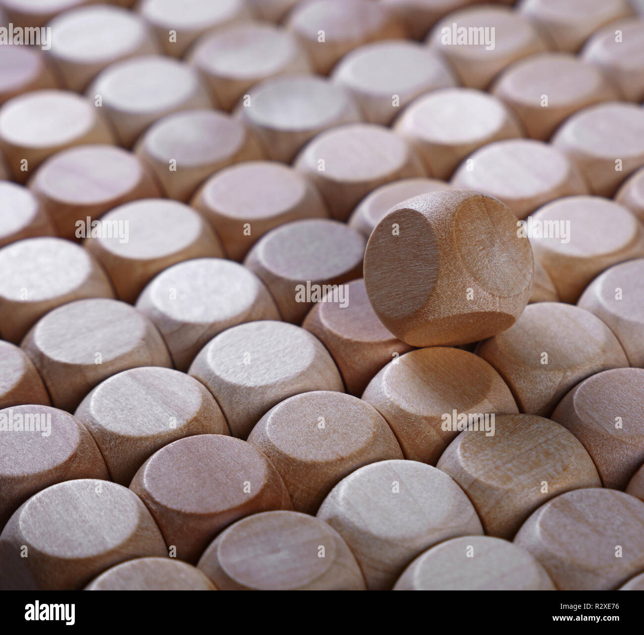 Close up background pattern of natural wooden dice shaped toy building blocks, high angle view perspective Stock Photo
