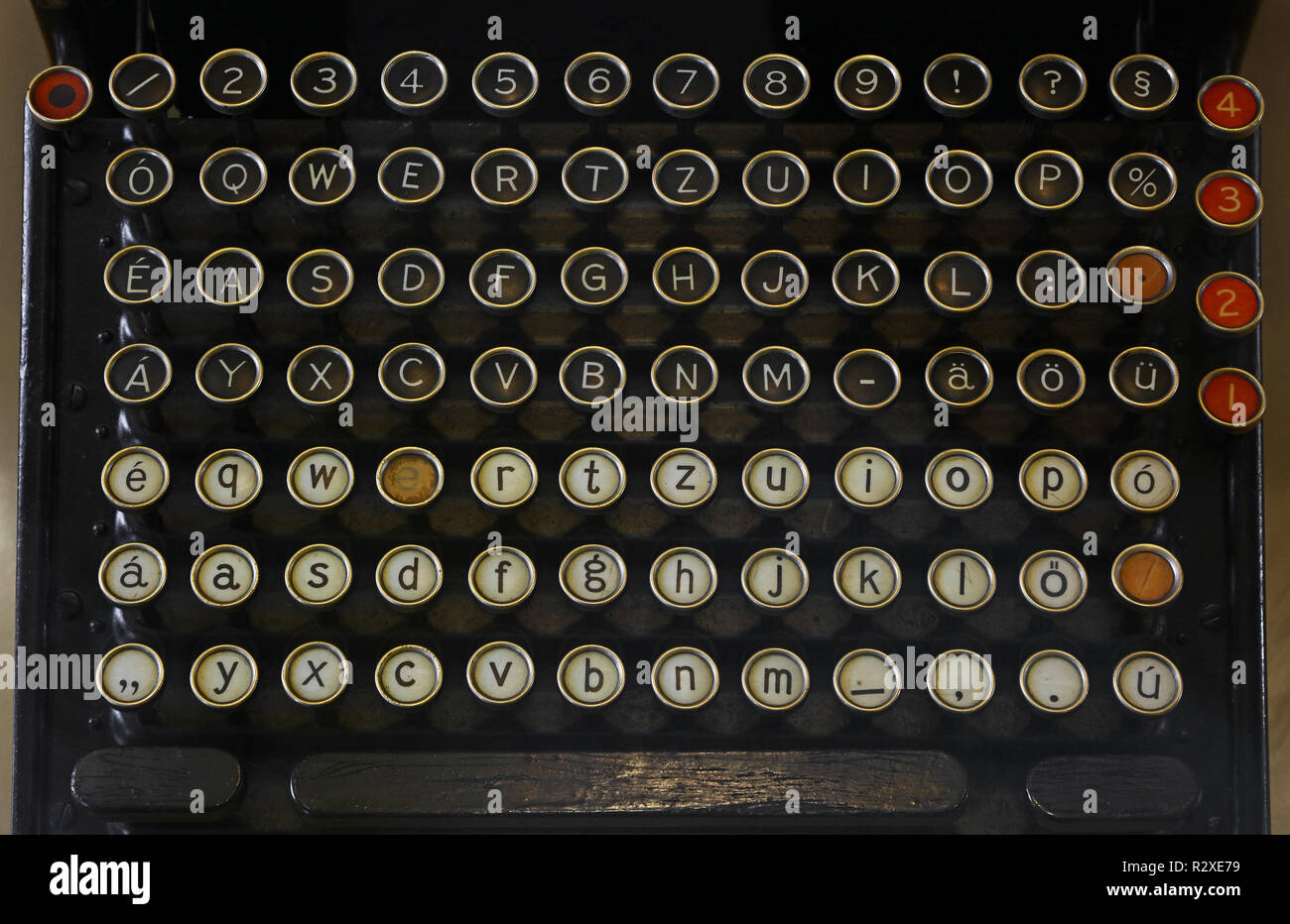 Latinic keyboard of old vintage antique typewriter with round buttons close up, high angle view, personal perspective Stock Photo