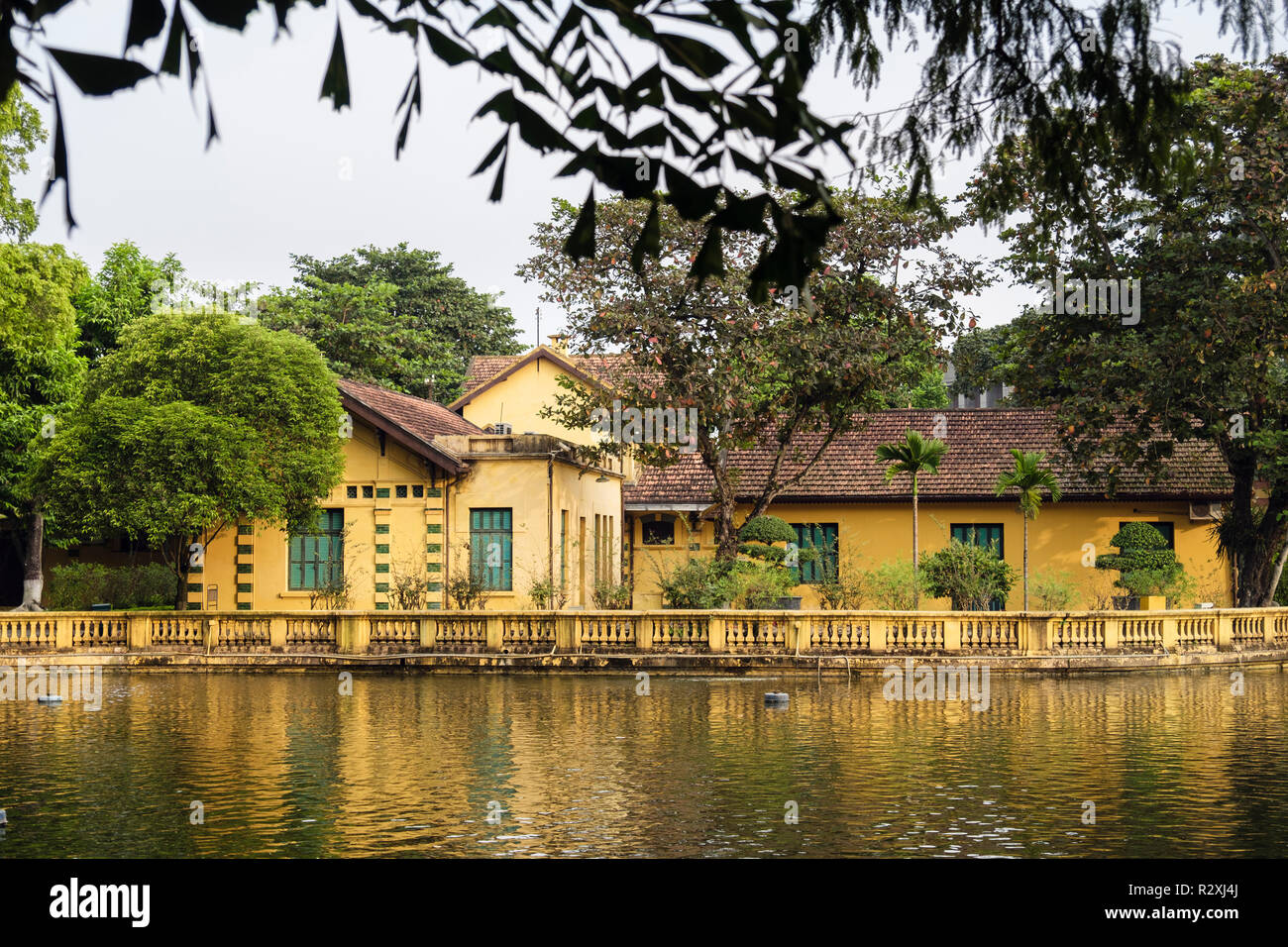 View across lake to house no 54 where President Ho Chi Minh lived in Presidential Palace grounds. Hanoi, Vietnam, Asia Stock Photo