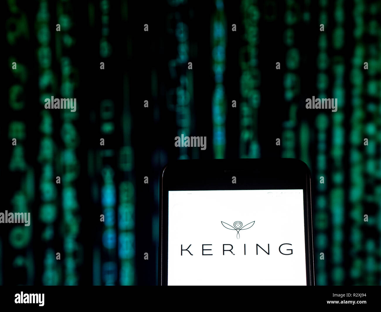 Kering Luxury goods company logo seen displayed on a smart phone. Kering  S.A. is an international luxury group based in Paris, France. It owns  luxury goods brands, including Gucci, Yves Saint Laurent