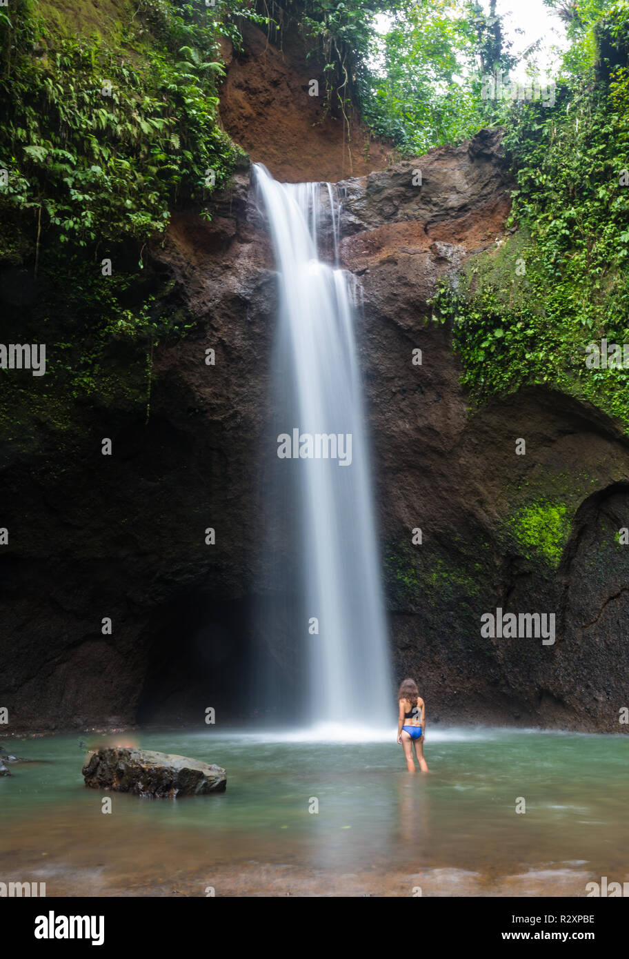 Girl in front waterfall hi-res stock photography and images - Alamy
