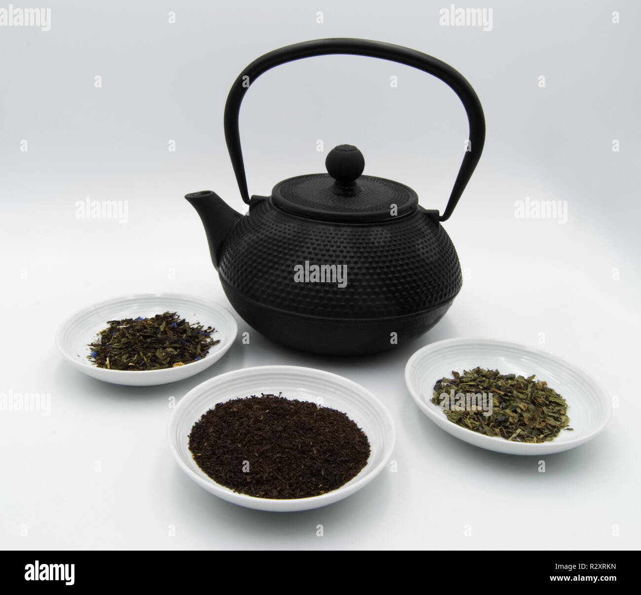 Teapot with different kinds of tea Stock Photo Alamy