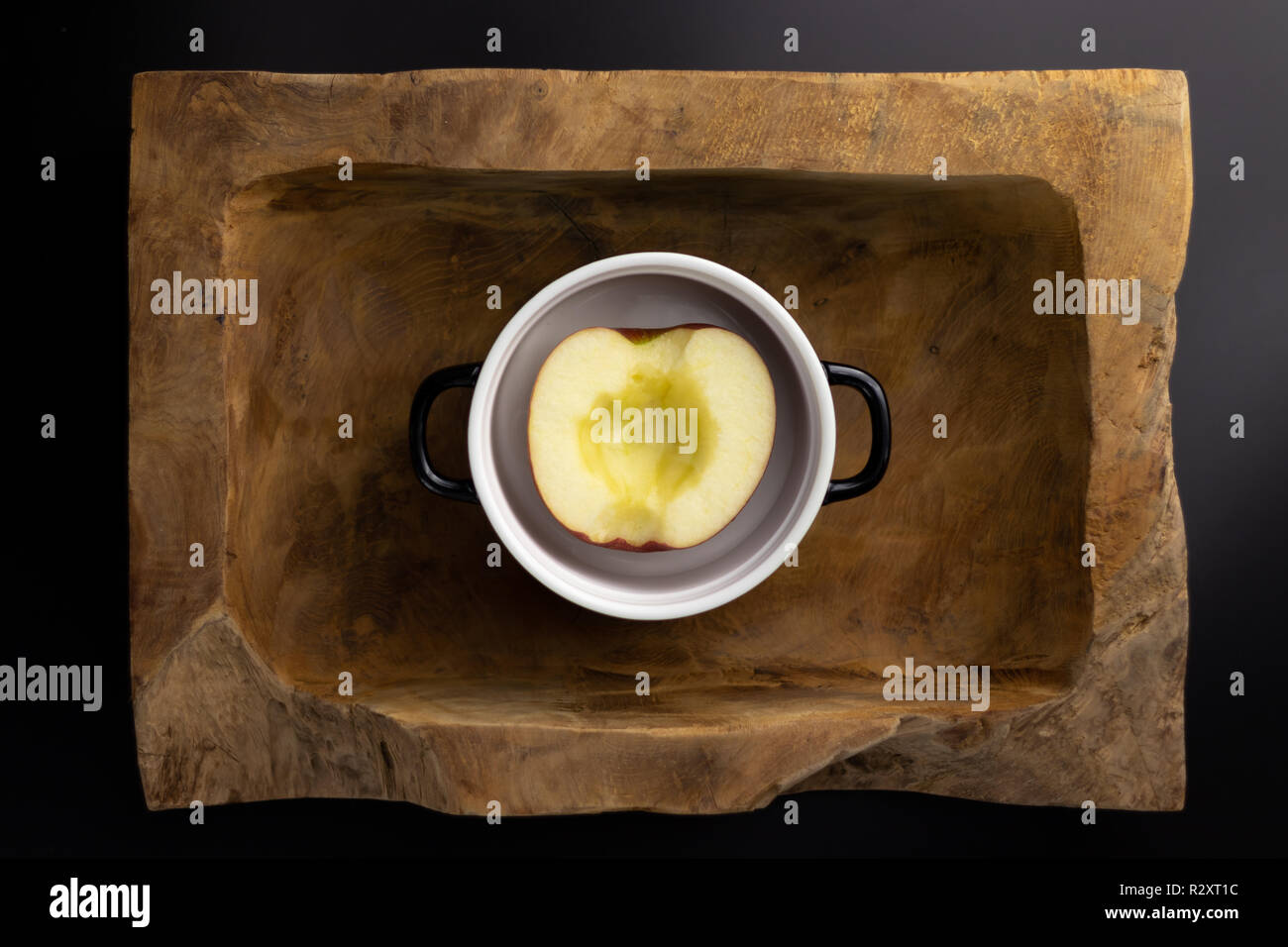 Breakfast on a wooden rectangular bowl with a black and white pot. Stock Photo