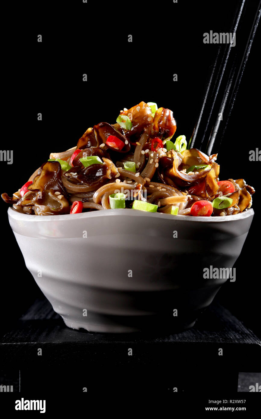 Wood ear mushroom and soba noodle vegetables salad pad thai on black