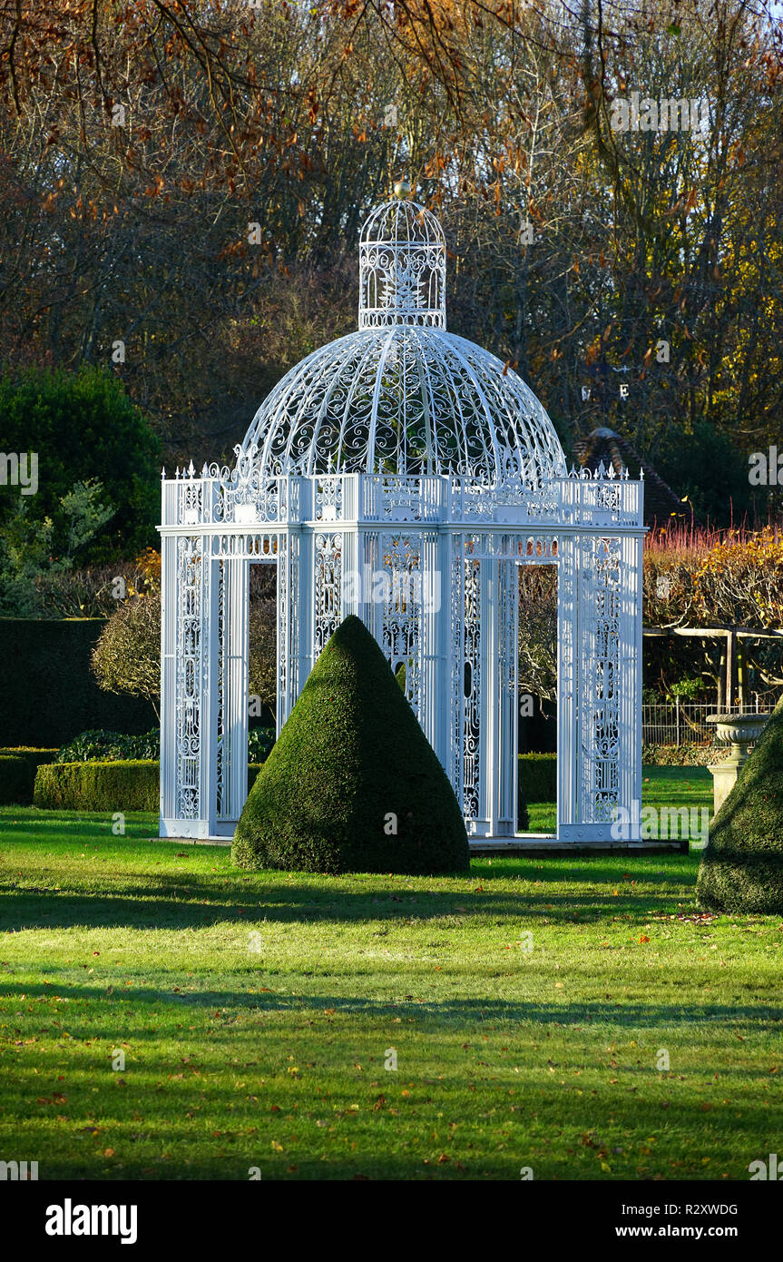 An ornamental gazebo in the gardens of Chenies Manor, Buckinghamshire.   Viewed from the public footpath at the rear of the property. Stock Photo