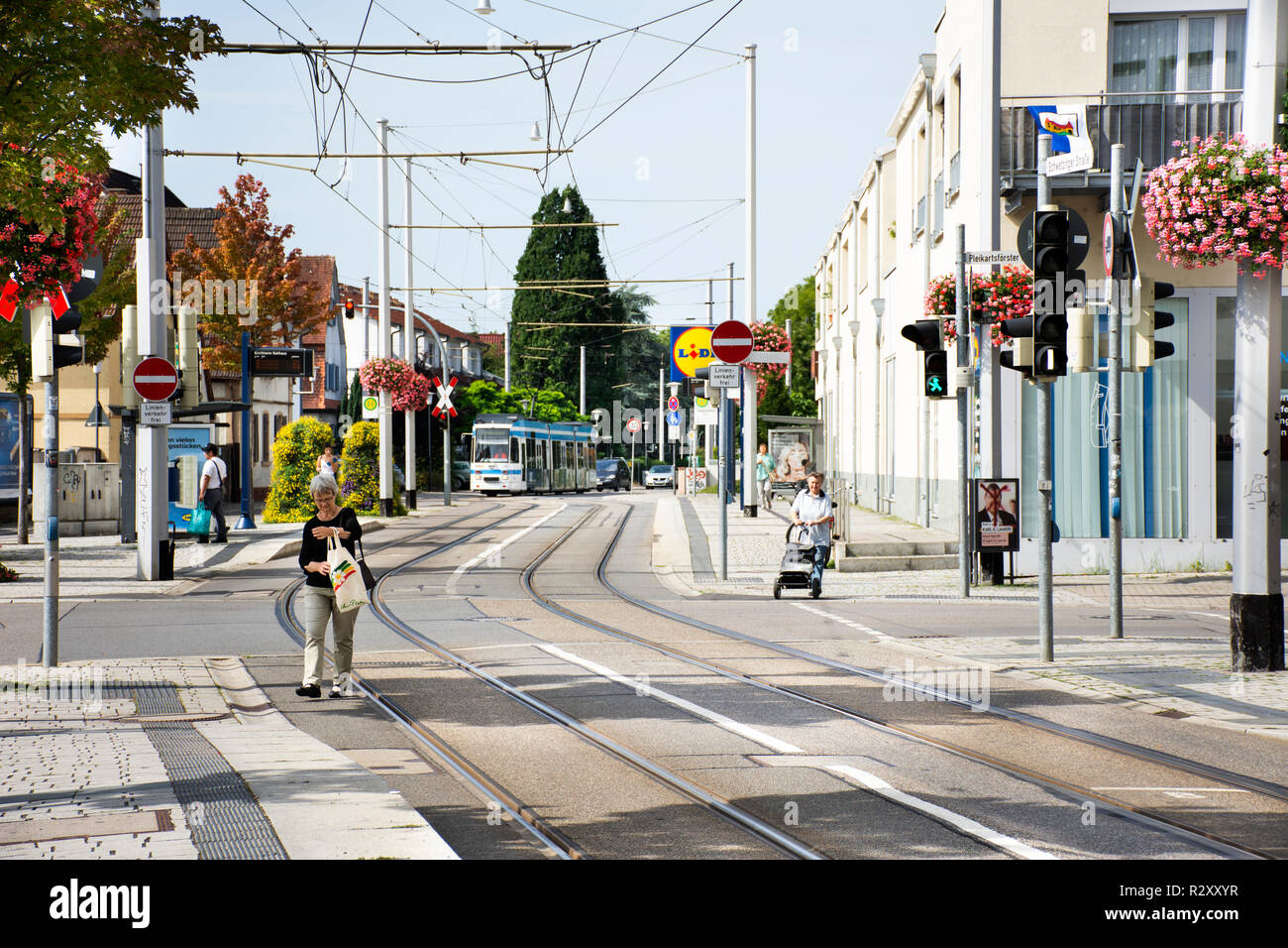 Tramway run and stopping for send and receive passengers German people and foreign travelers in station at Sandhausen village on August 25, 2017 in He Stock Photo