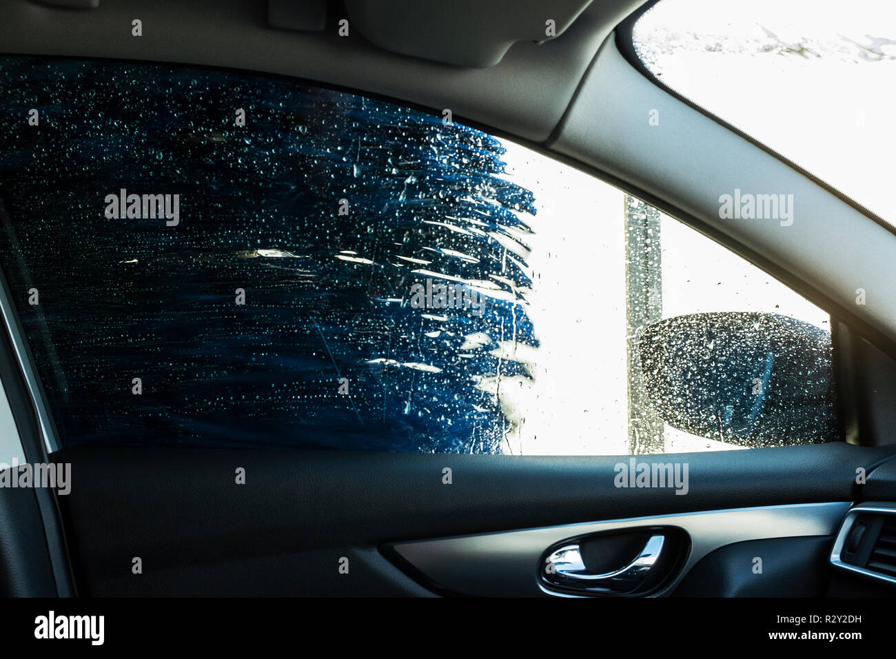 View From The Inside Of A Car In An Automated Car Wash Blue