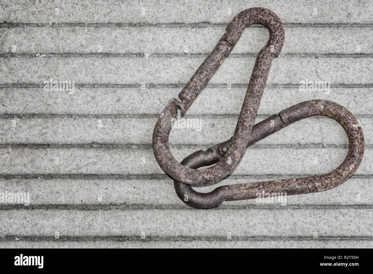 Two rusty brackets on a concrete striped slab Stock Photo