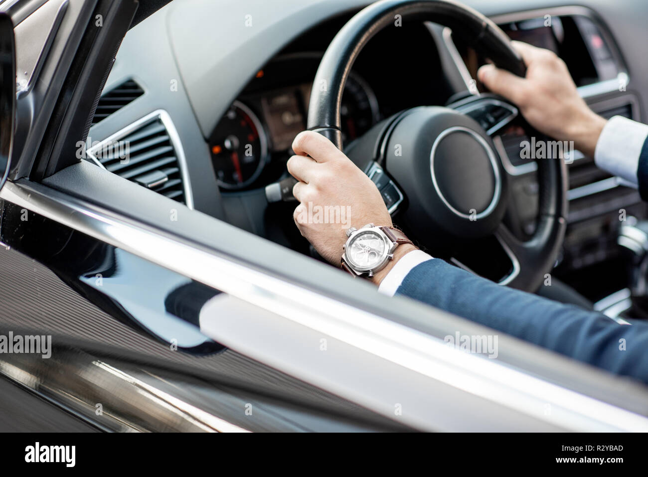 Hands on steering wheel hi-res stock photography and images - Alamy