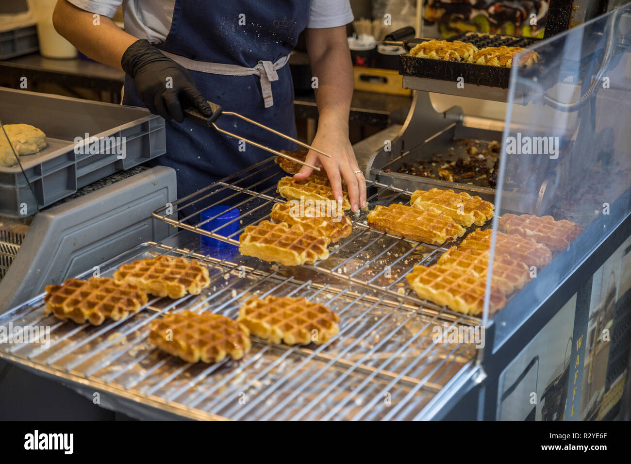 Woman baking traditional Brussels waffles Stock Photo