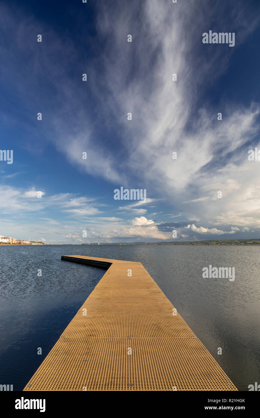 Jetty on the Marine Lake at West Kirby, with cirrus clouds, England Stock Photo