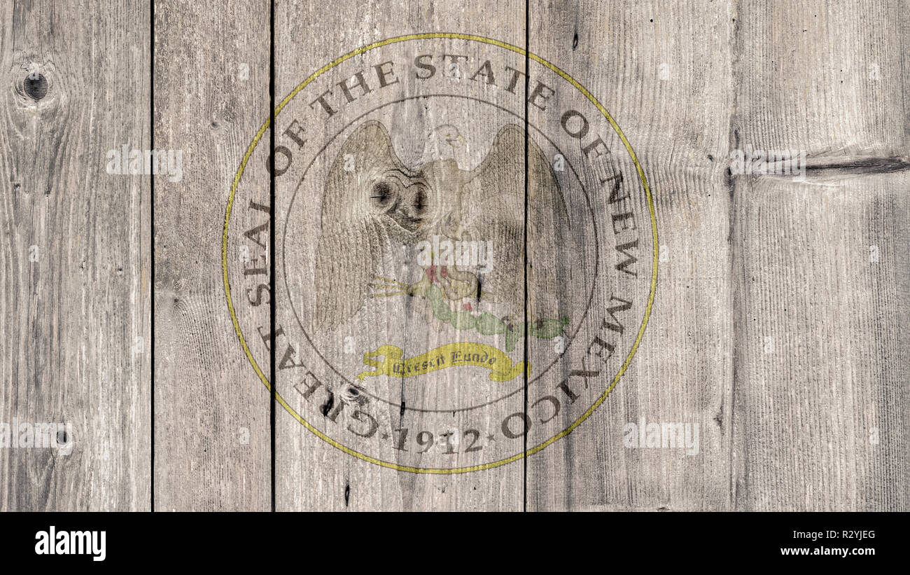 USA Politics News Concept: US State New Mexico Seal Wooden Fence Background Stock Photo