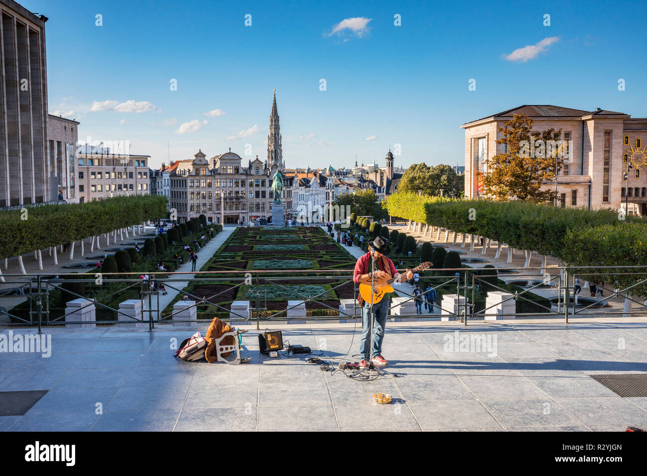 Musitian playing guitar at sunny day in Mont des Arts in Brussels Stock Photo