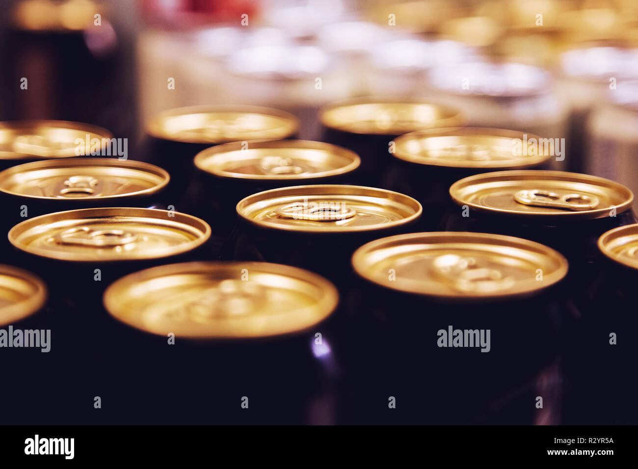 metal beer cans background black Stock Photo - Alamy