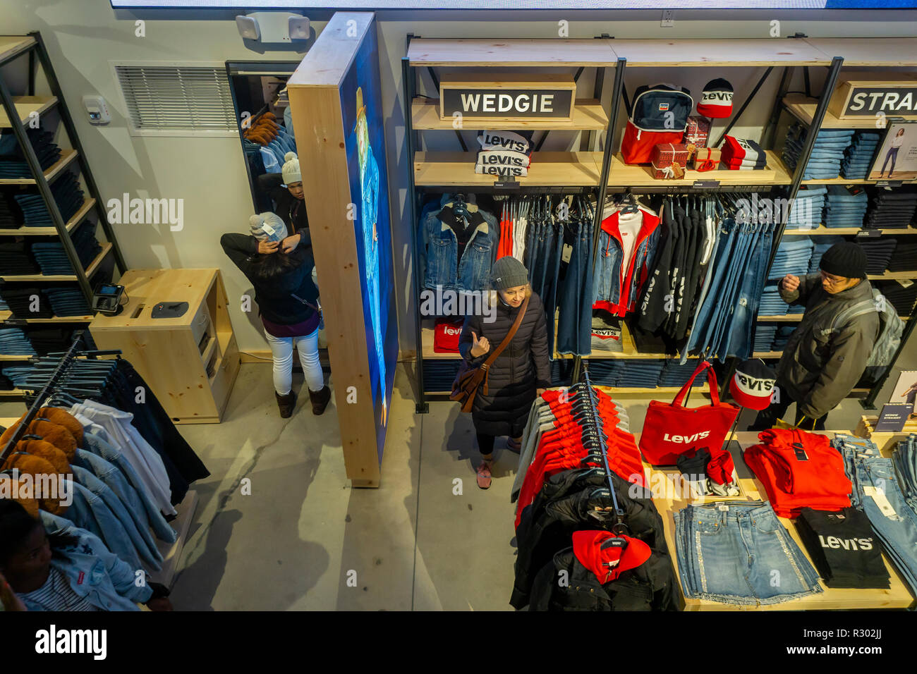 Shoppers search for denim in the Levi Strauss and Co.'s new flagship store  in Times