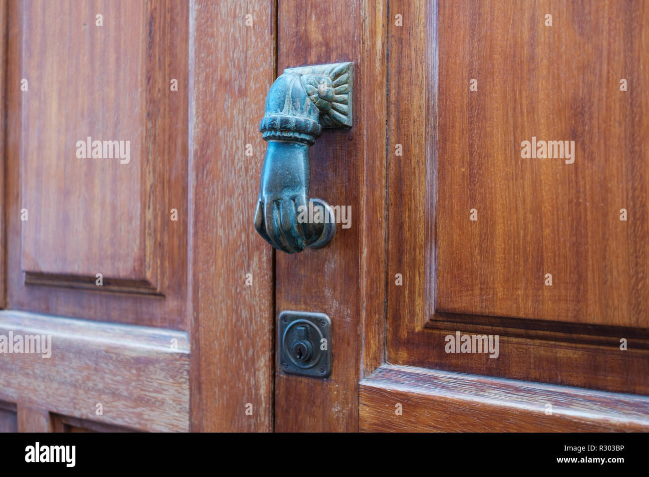 door knob, hand shape knocking door knob Stock Photo