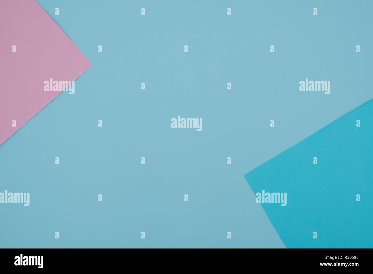 Blue and pink pastel color paper geometric flat lay background - Stock Photo