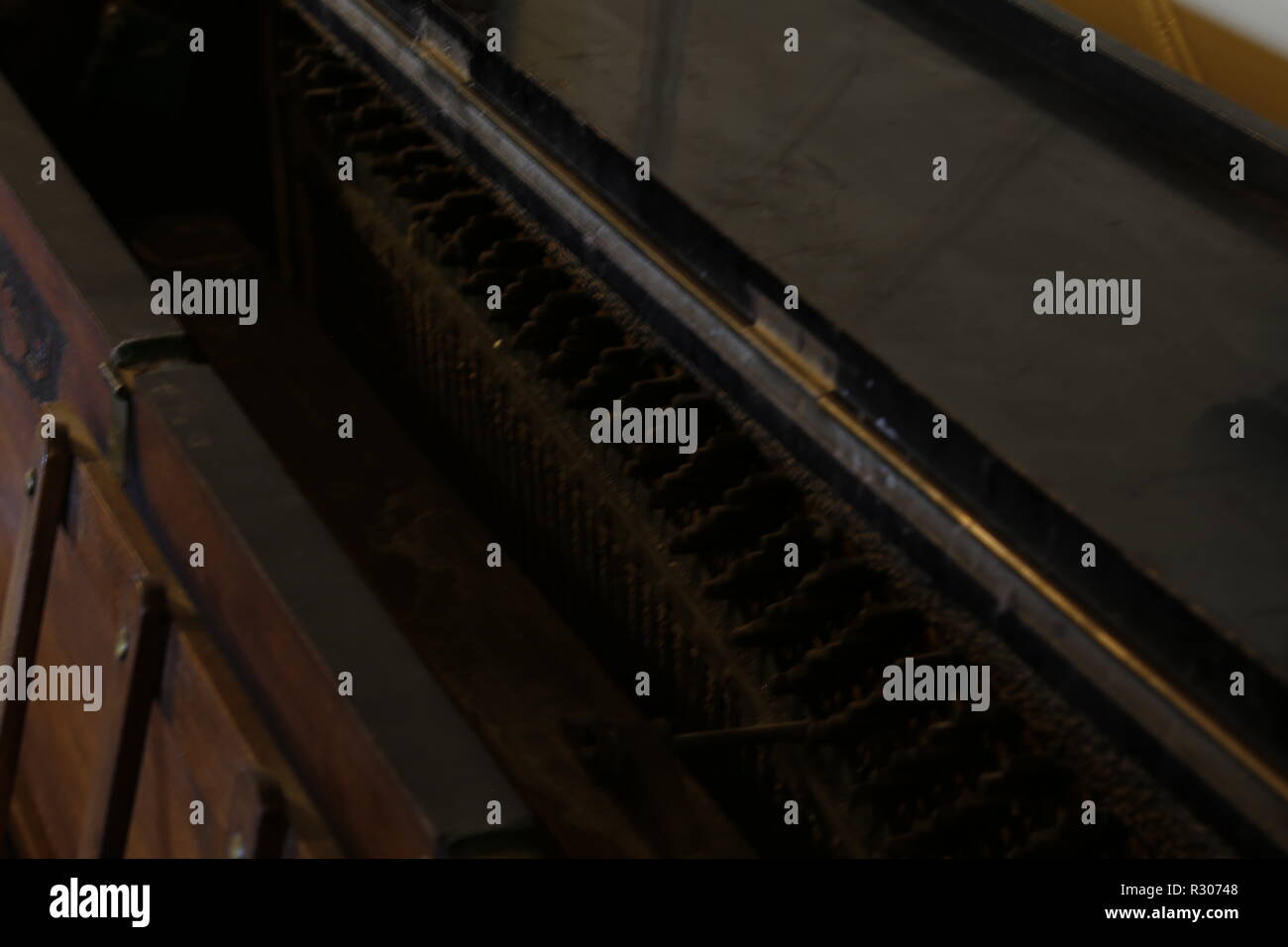 Inside old upright piano in hallway Stock Photo Alamy