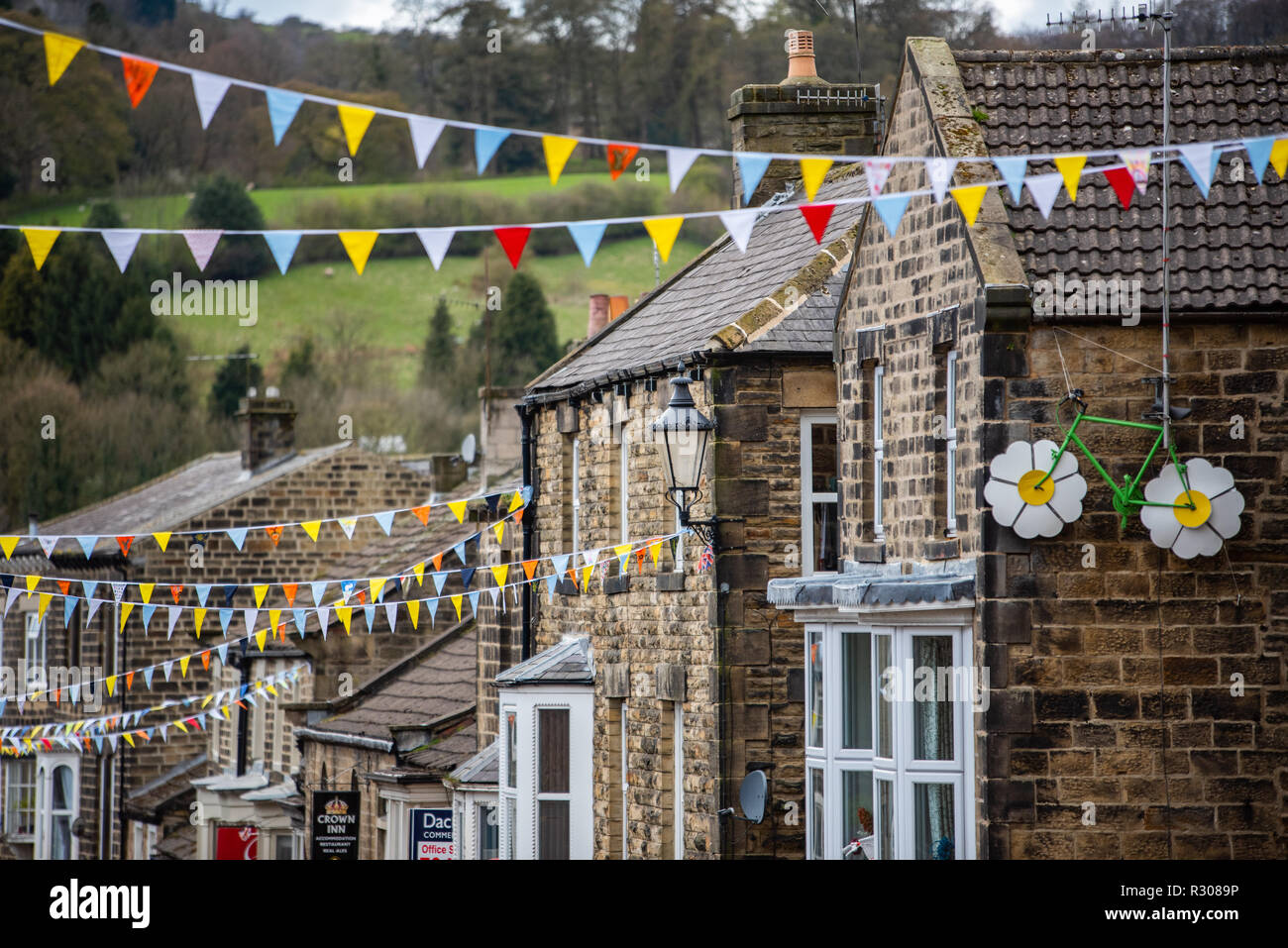 Colourful bunting hangs over the high street in Pateley Bridge in Nidderdale in the Borough of Harrogate, North Yorkshire, England Stock Photo
