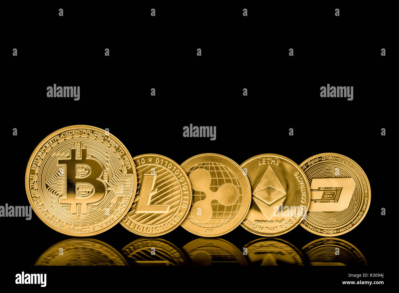 crypto currency golden metal coins on black background Stock Photo