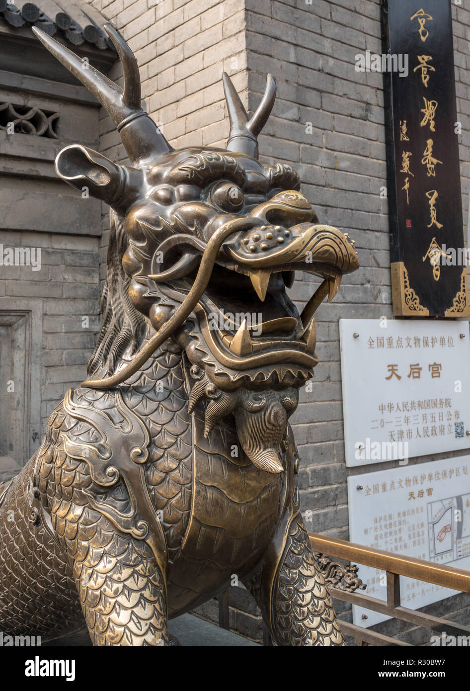 Rubbing hand of statue brings good luck in Tianjin Stock Photo Alamy
