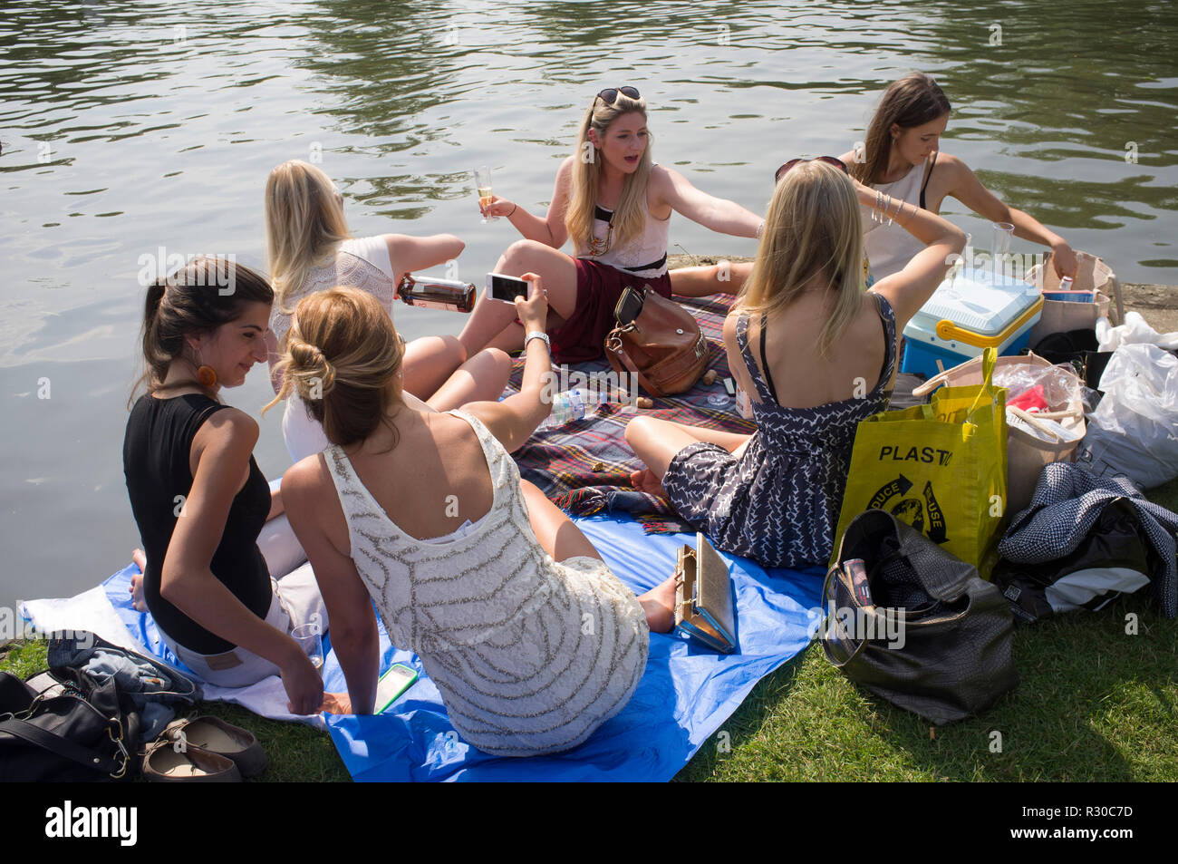Girls enjoy a party on the towpath at Henley Regatta, Henley-on-Thames, Oxfordshire Stock Photo