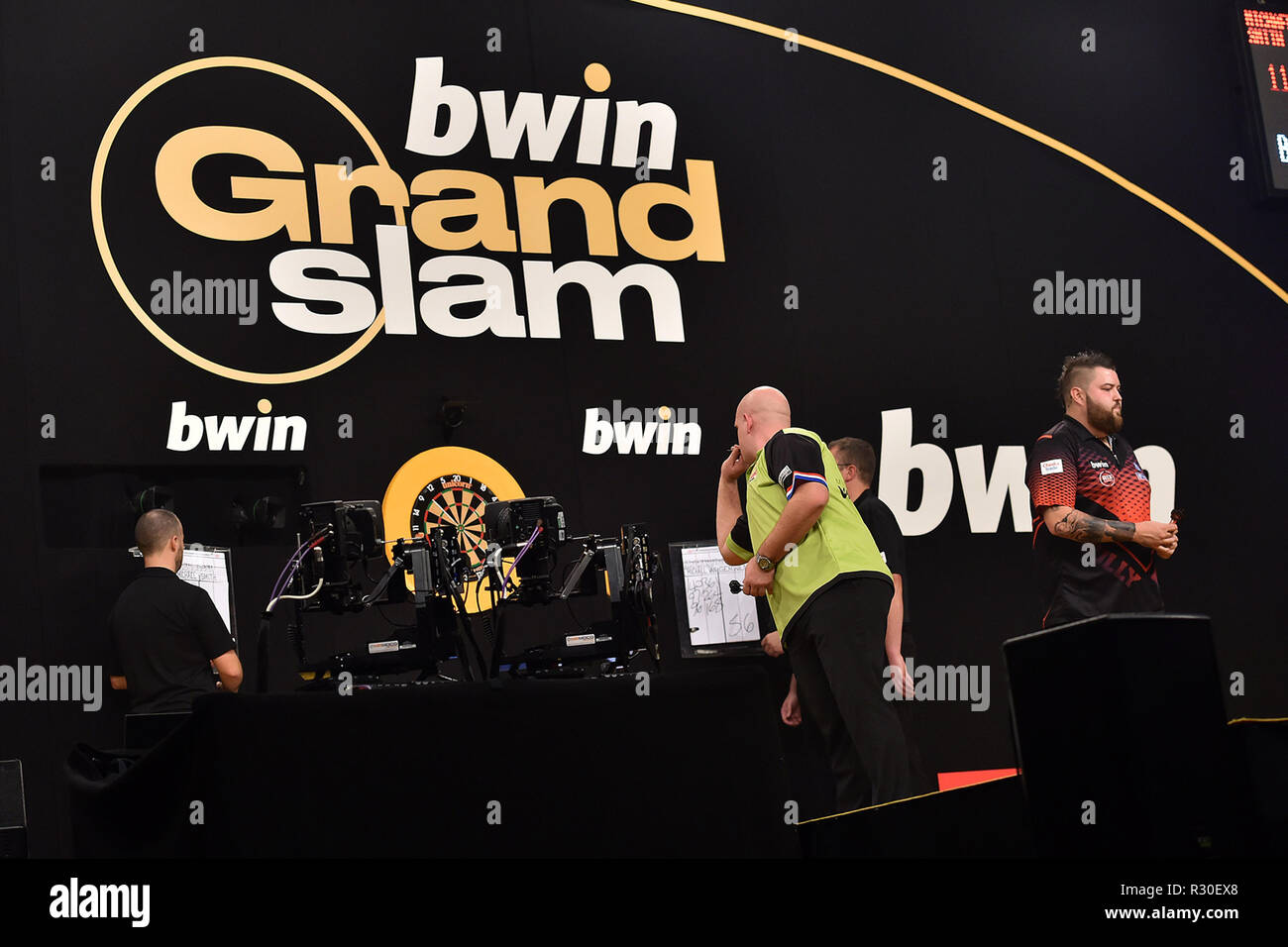 Wolverhampton, United Kingdom. 15th November 2018. Michael Van Gerwen in  action with Michael Smith in the background during the BWIN Grand Slam of  Darts Group stage at Aldersley Leisure Village, Wolverhampton (©