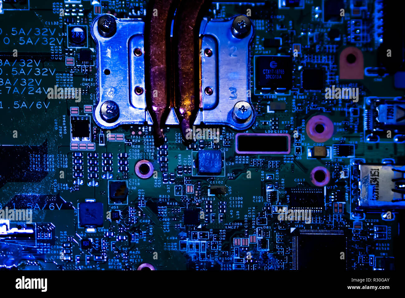 Light reflections from a dark motherboard. Stock Photo