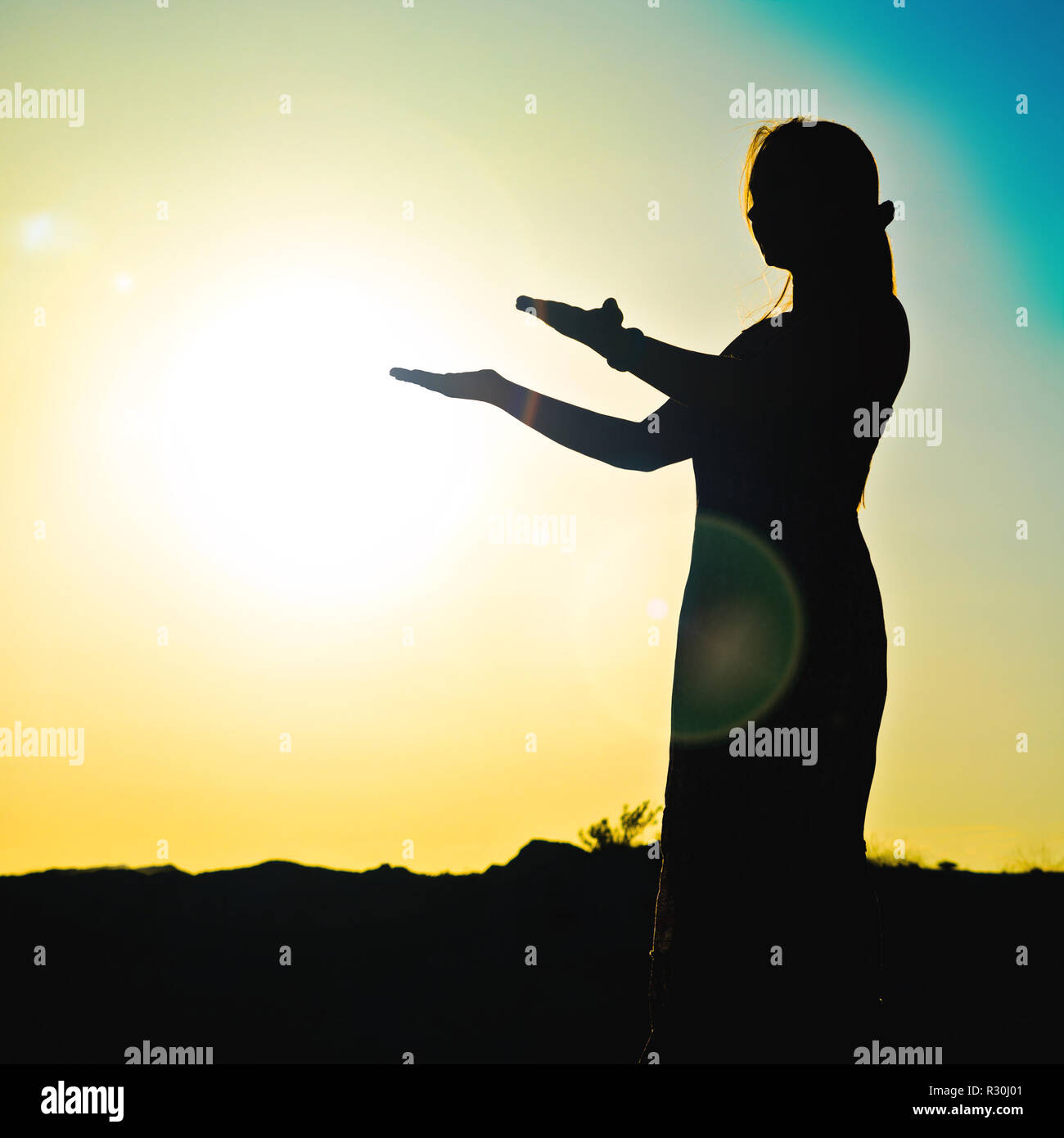 woman silhouette in front of a sunset Stock Photo - Alamy