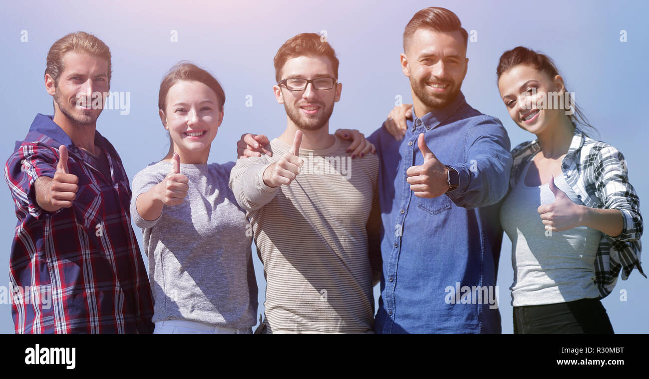 group of young people showing thumb up Stock Photo - Alamy