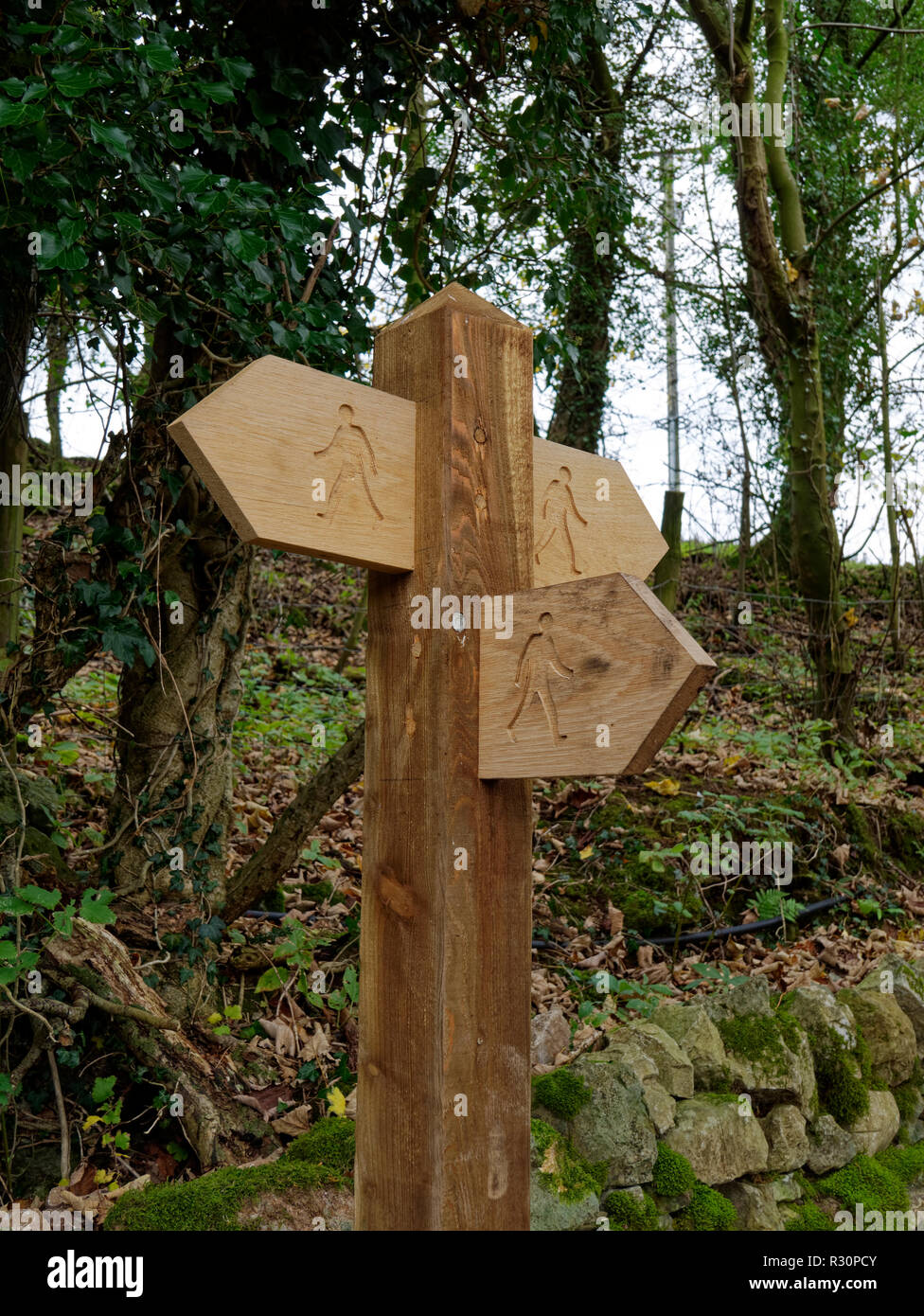 Helpful signpost on a footpath near Sizergh Castle in Cumbria. Probably not as helpful in reality as intended. Stock Photo