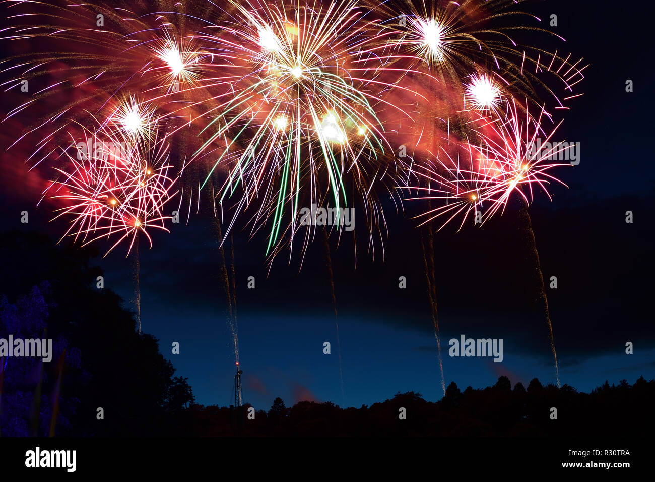 Long exposure of fireworks exploding in the sky at night Stock Photo ...