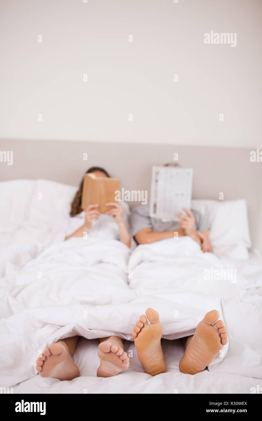 Mature couple feet bed high