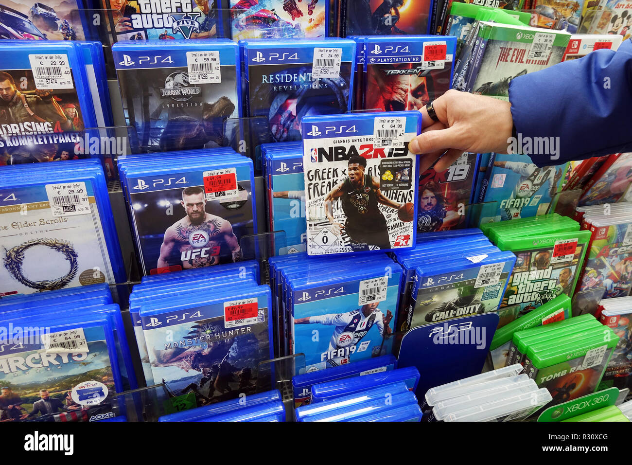 Store display filled with PlayStation 4 games for a home video game console  Stock Photo - Alamy