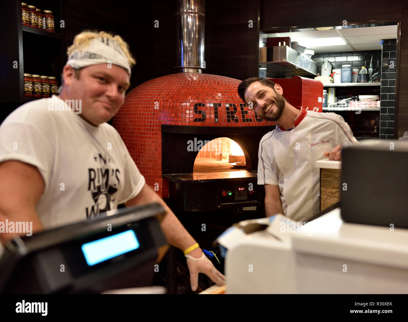 Pizza kitchen with chefs and oven, Rina's Pizzeria & Cafe, Italian quarter downtown Boston, Massachusetts, USA Stock Photo