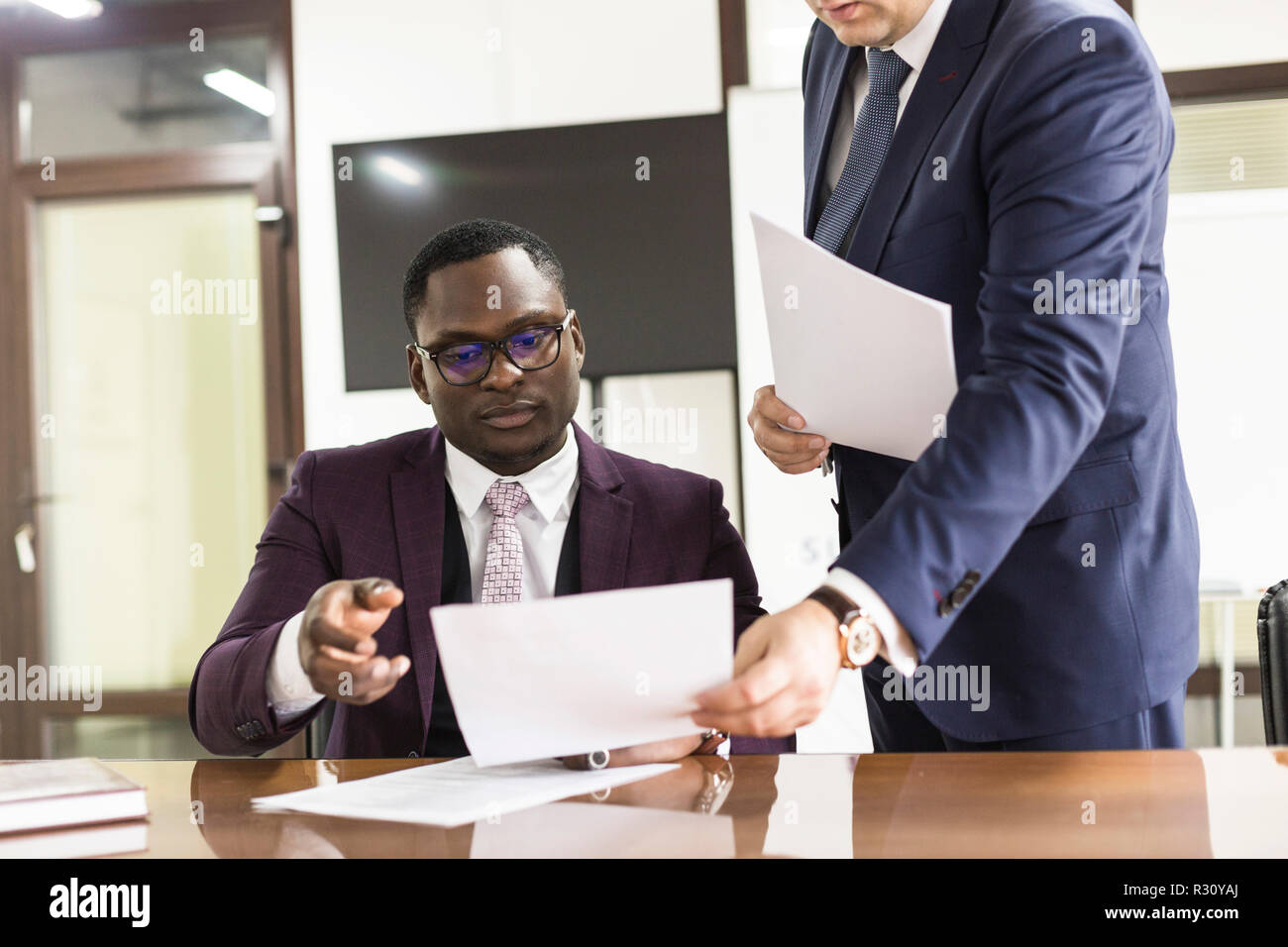 African american man signing contract black man hand putting signature African american man signing contract black man hand putting signature