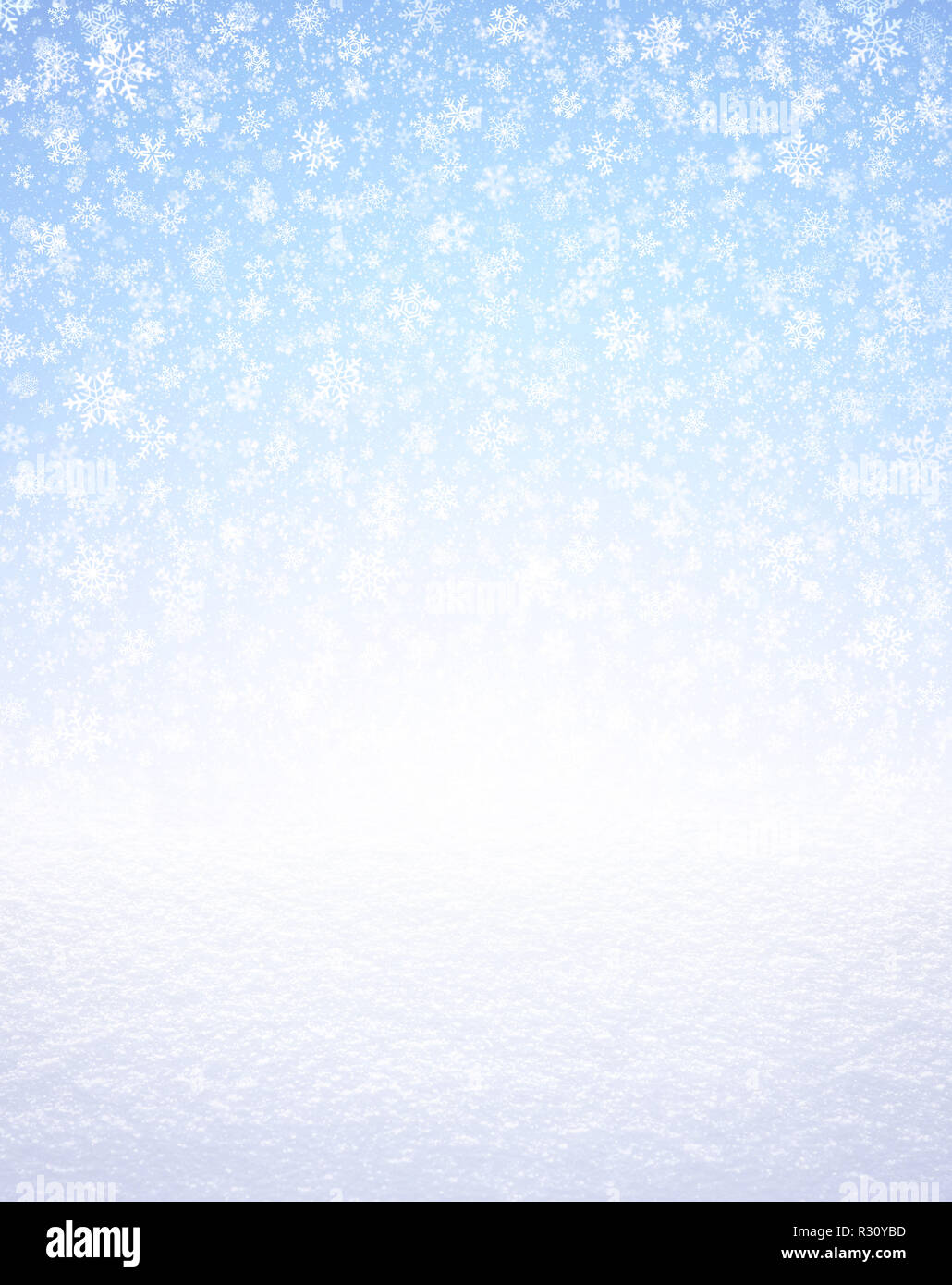 Snowflakes shapes on an icy blue background, falling on a white snow covered ground. Winter seasonal material. Stock Photo
