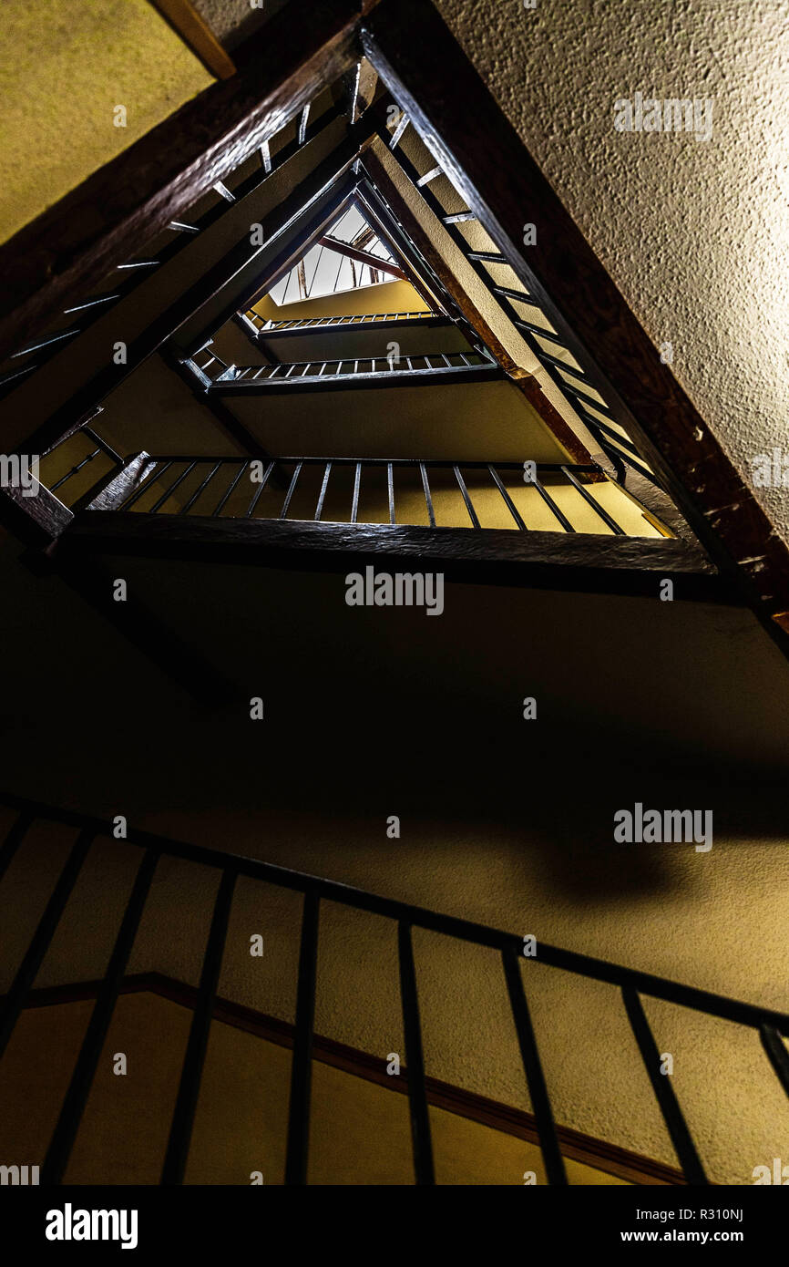 Low angle view of a triangular stairwell, Madrid, Spain. Stock Photo