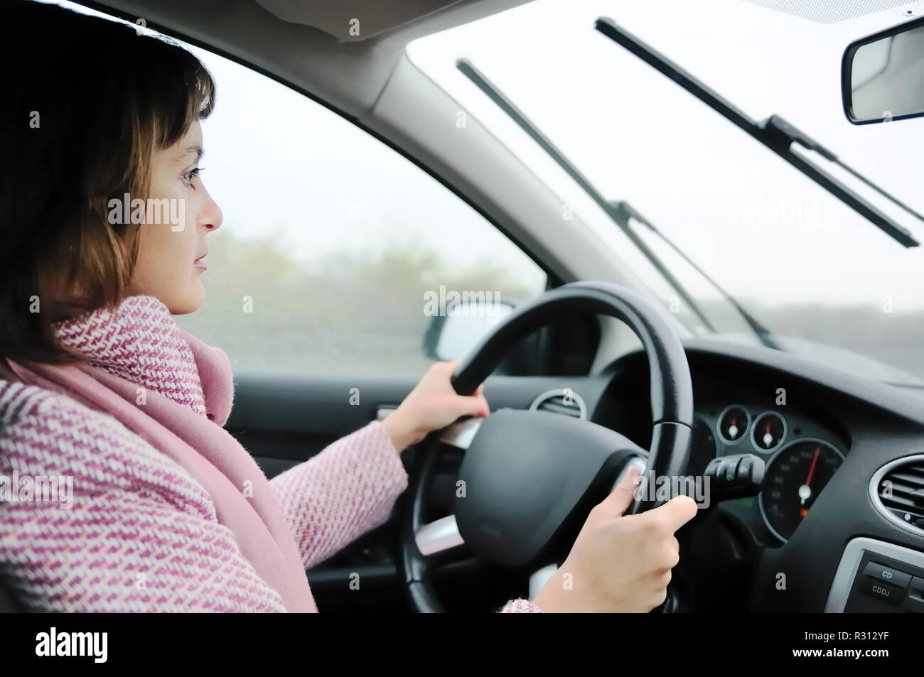 Car people inside raining hi-res stock photography and images - Alamy