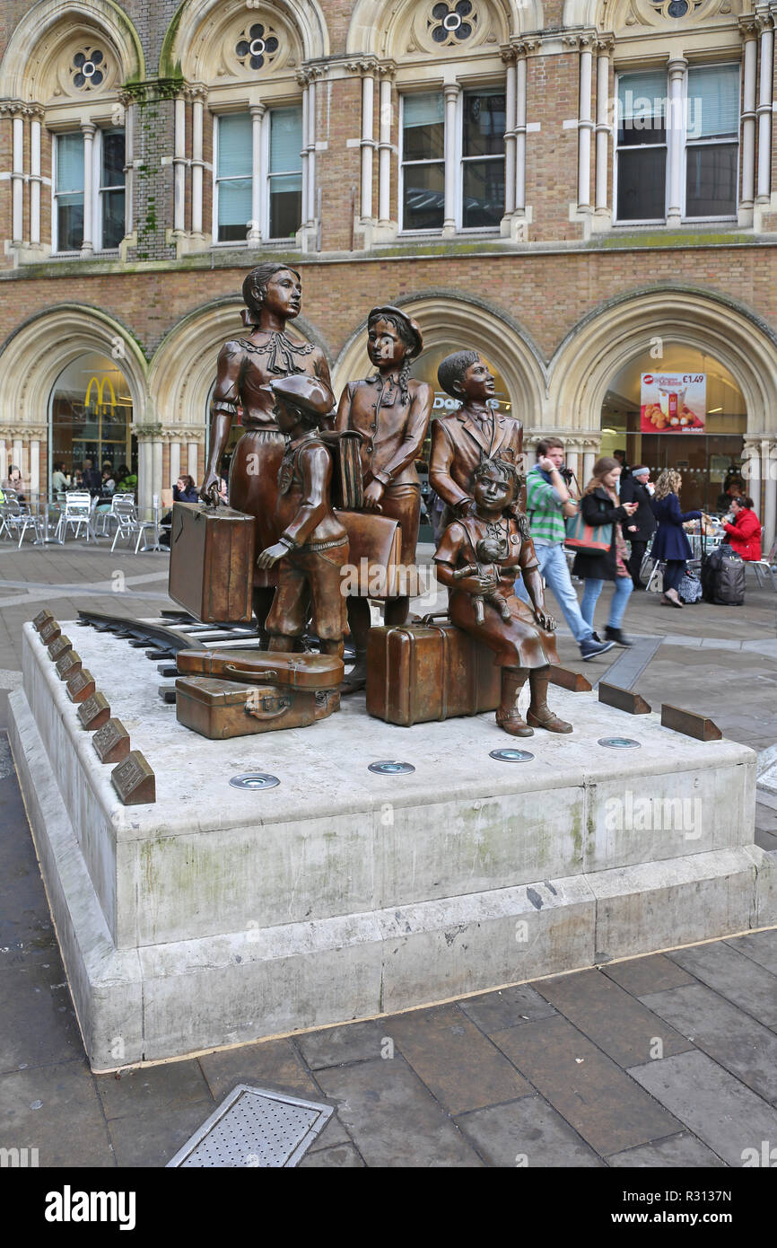 LONDON, UNITED KINGDOM - NOVEMBER 24, 2013: The Kindertransport Statue Children Transport in Front of Liverpool Street Station in London, United Kingd Stock Photo