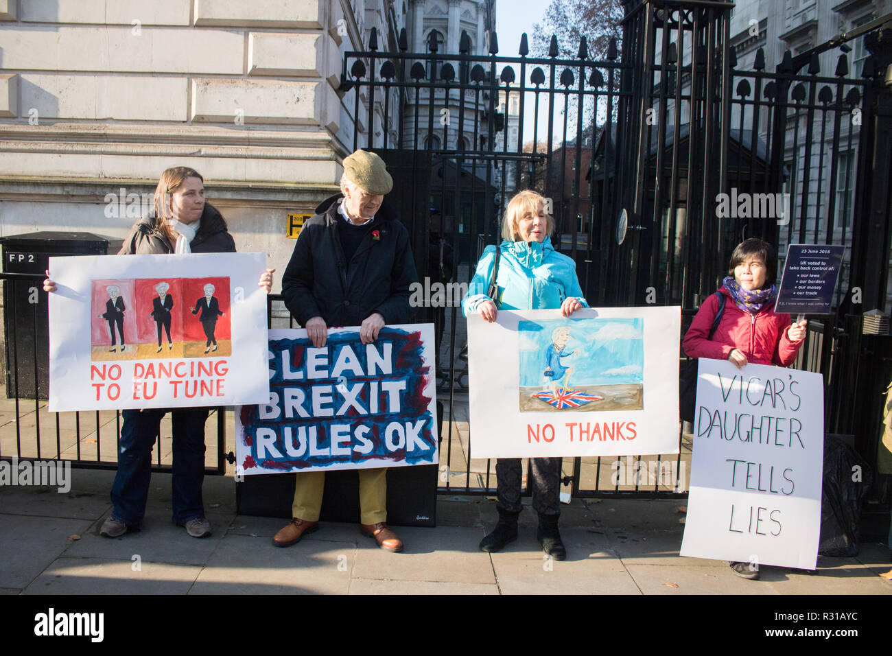 London UK. 21st November 2018. A small group of Pro Brexit protesters with placards voice their displeasure at the Brexit draft agreement outside Downing Street as Prime Minister Theresa May is scheduled to travel to Brussels to attend discussions with the  President of the European Commission Jean-Claude Juncker, regarding a political declaration to and Britain's future relationship with the European Union to accompany the withdrawal agreement Credit: amer ghazzal/Alamy Live News Stock Photo