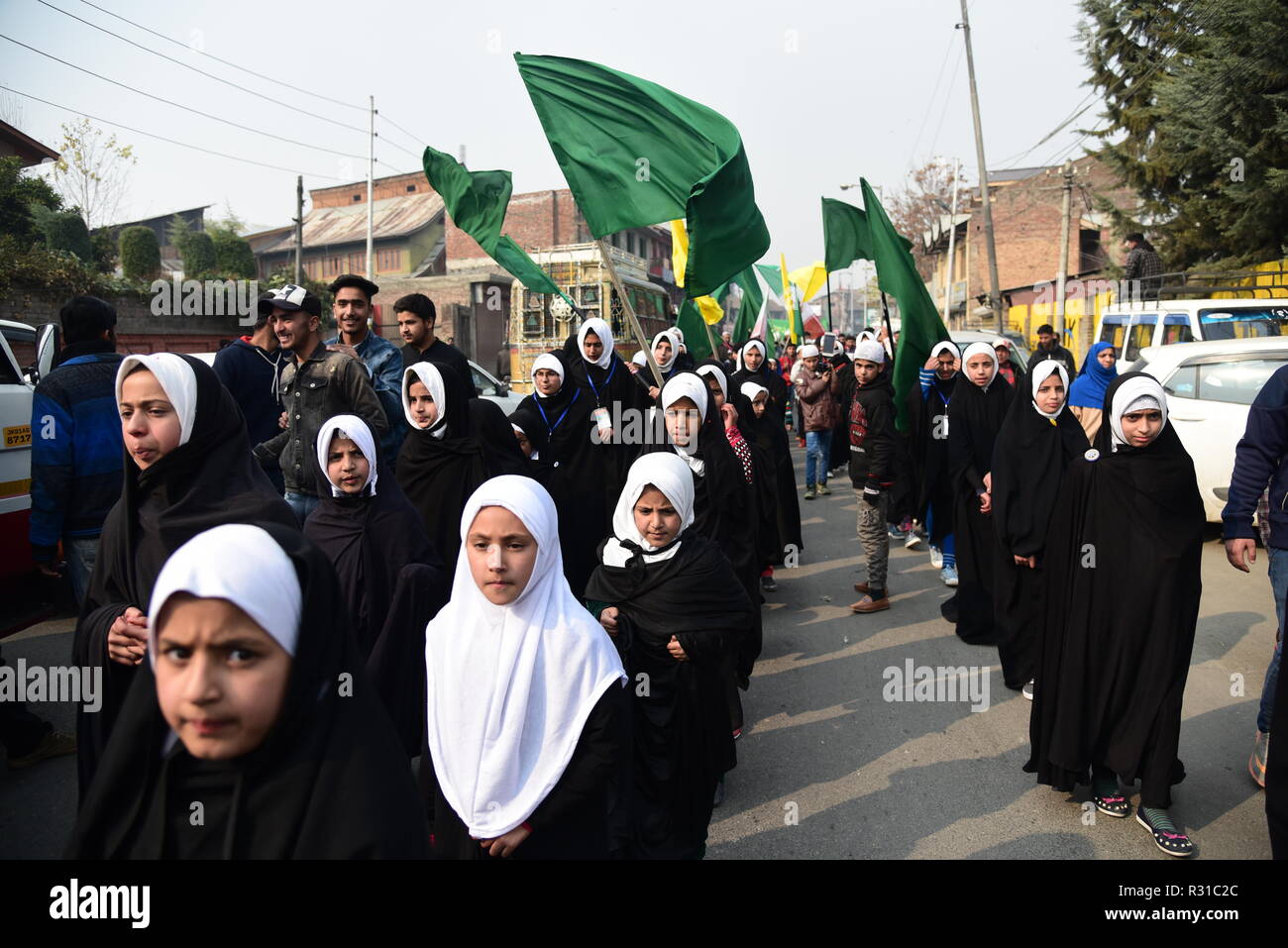 Kashmiri Shia Muslim students are seen Marching in a rally during celebrations marking Eid-i-Milad-un-Nabi, the birth anniversary of Prophet Muhammad PBUH. Muslims across the world celebrated Eid-e-Milad-un-Nabi, the birth anniversary of the Prophet Mohammed on 12 Rabil ul Awal, a month of the Muslim calendar which falls on 21 November 2018. Stock Photo