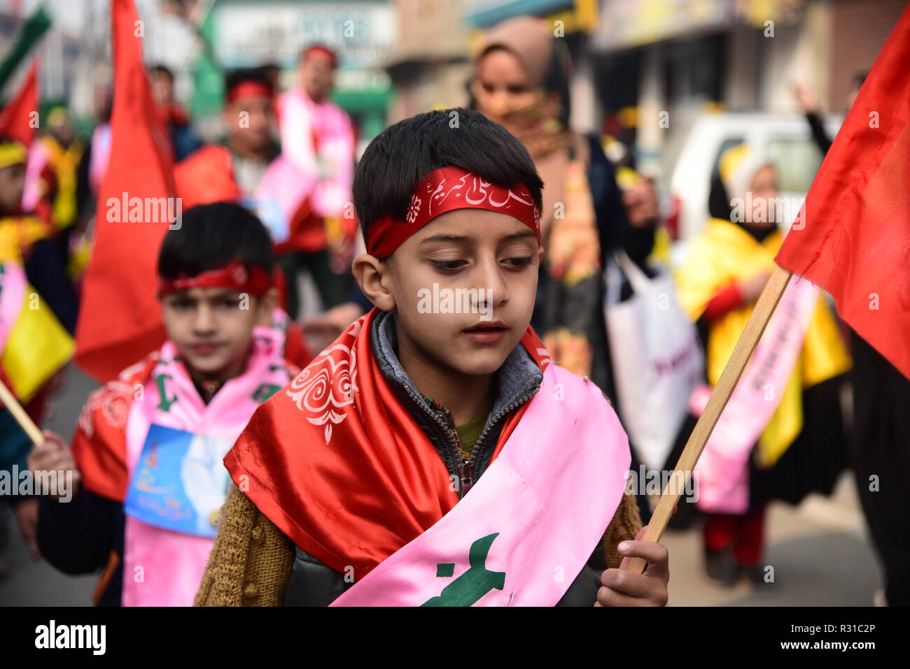 A Kashmiri Shia Muslim student seen looking on during a march rally marking Eid-i-Milad-un-Nabi, the birth anniversary of Prophet Muhammad PBUH. Muslims across the world celebrated Eid-e-Milad-un-Nabi, the birth anniversary of the Prophet Mohammed on 12 Rabil ul Awal, a month of the Muslim calendar which falls on 21 November 2018. Stock Photo