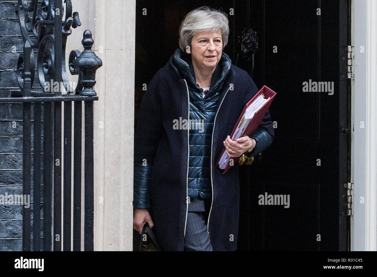 London, UK. 21st November, 2018. Prime Minister Theresa May leaves 10 Downing Street to attend Prime Minister's Questions in the House of Commons on the day on which she is scheduled to travel to Brussels to attend discussions with Jean-Claude Juncker, President of the European Commission, regarding a political declaration to accompany the EU withdrawal agreement. Credit: Mark Kerrison/Alamy Live News Stock Photo