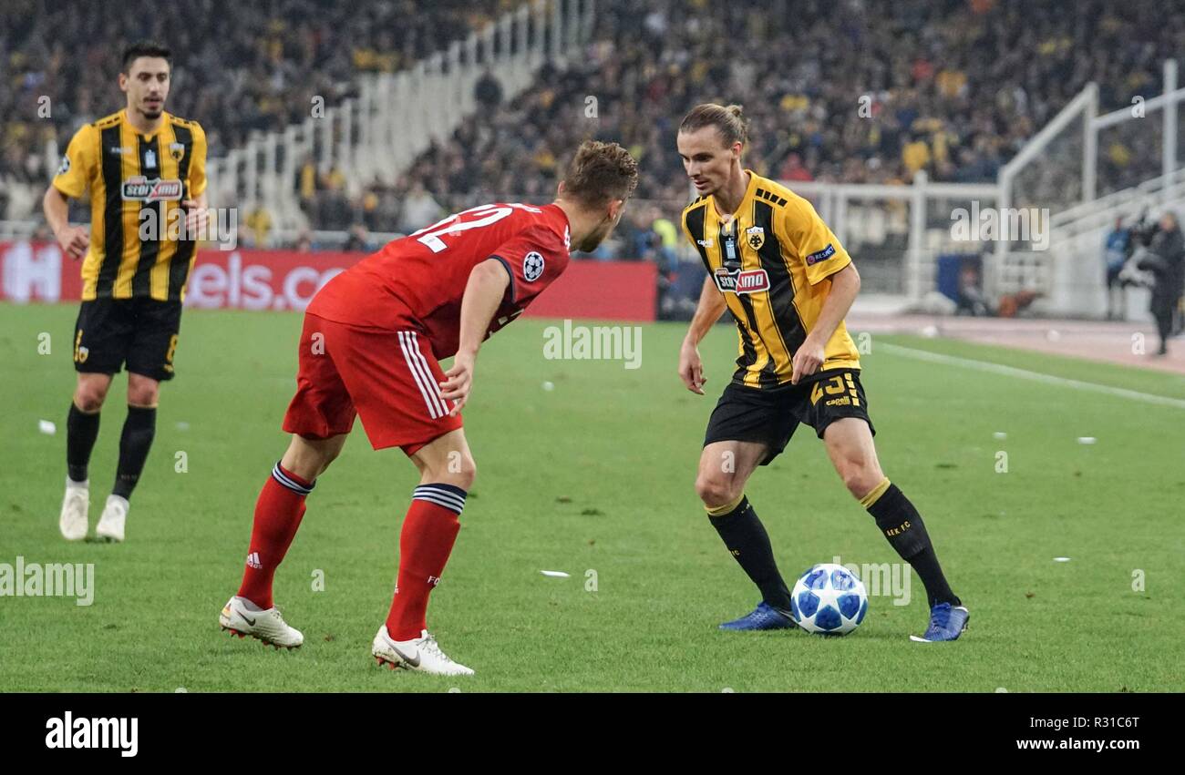 Athens, Greece. 23rd Oct, 2018. Niklas Hult of Aek Athens FC and Javi Martinez of Bayern Munich are seen in action during the Group E match of the UEFA Champions League between AEK FC and Bayern Munich FC at the Olympic Stadium in Athens. Credit: Ioannis Alexopoulos/SOPA Images/ZUMA Wire/Alamy Live News Stock Photo