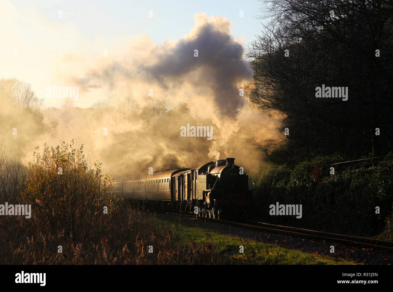 42073 approaches Lakeside on the Lakeside & Haverthwaite Railway. as the sun starts to set Stock Photo