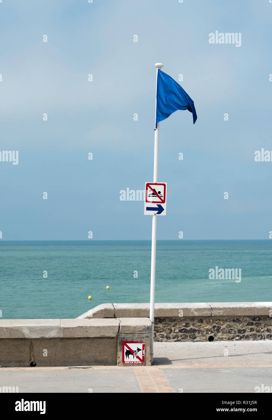 Blue flag indicating the limit of the safe bathing zone in the sea at Hautot-sur-Mer,  Seine-Maritime,  Normandy, France, Europe Stock Photo