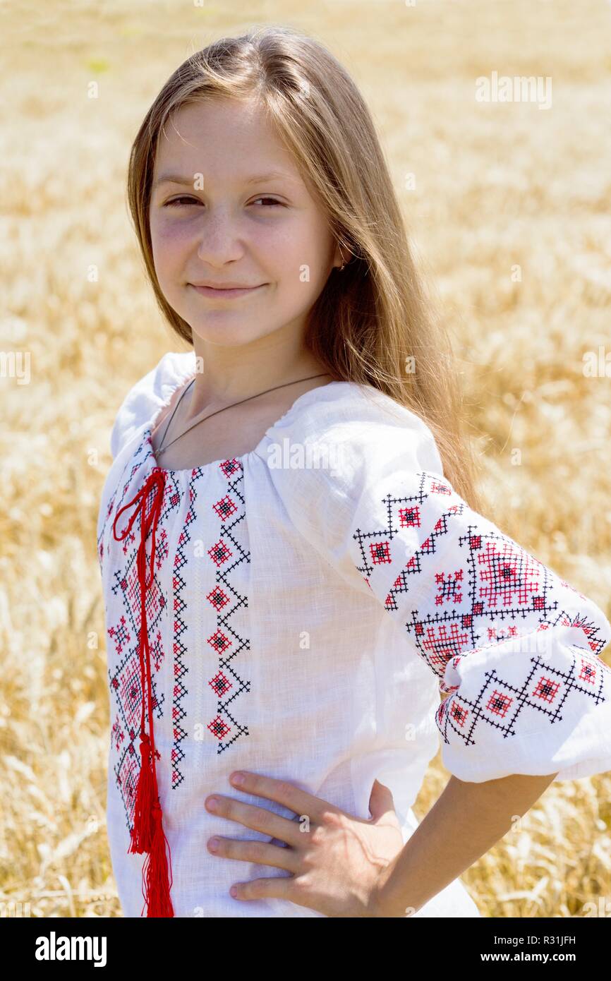 little ukrainian smiling girl in a wheat field Stock Photo - Alamy